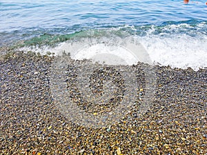 sea Ã¢â¬â¹Ã¢â¬â¹wave and pebbles on the beach